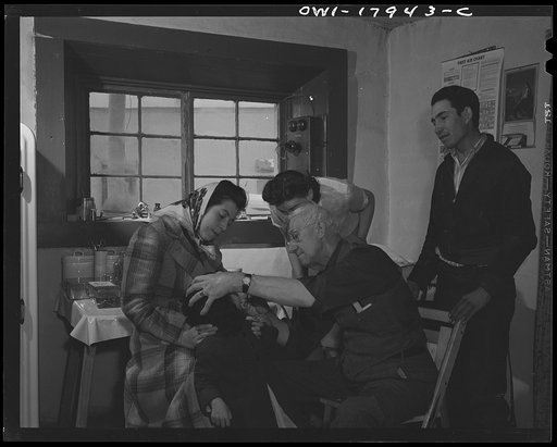 Untitled photo, possibly related to: Penasco, New Mexico. Doctor Onstine making an examination in the clinic operated by the Taos County cooperative health association