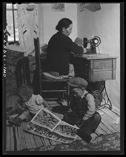 Untitled photo, possibly related to: Trampas, New Mexico. Mrs. Maclovia Lopez, wife of the majordomo (mayor) [i.e., steward], is never idle; cooking, washing, spinning, and sewing are only some of her many responsibilities
