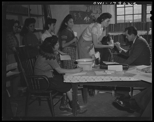 Untitled photo, possibly related to: Penasco, New Mexico. Public health doctor making a dental survey in the grade school