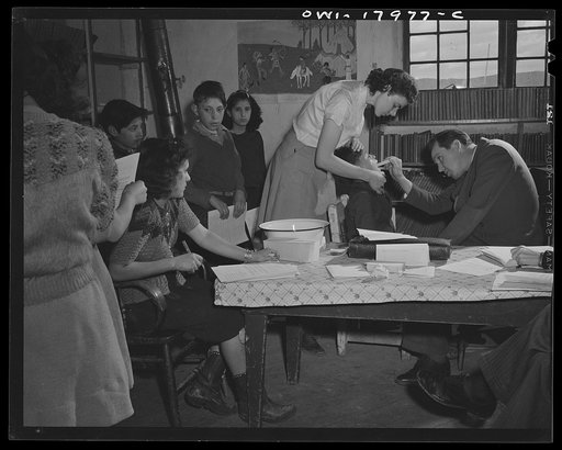 Penasco, New Mexico. Public health doctor making a dental survey in the grade school