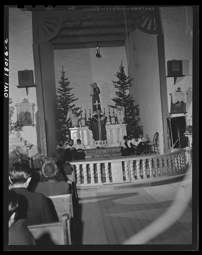 Untitled photo, possibly related to: Questa, New Mexico. Father Smith preaching in Spanish over the loudspeaker in the church