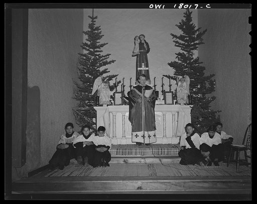 Questa, New Mexico. Father Smith preaching in Spanish over the loudspeaker in the church