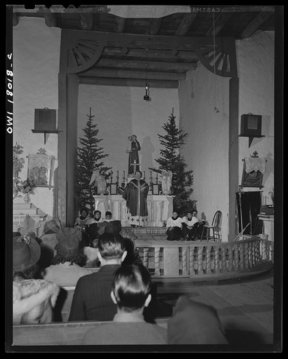 Questa, New Mexico. Father Smith preaching in Spanish over the loudspeaker in the church