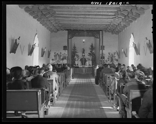 Untitled photo, possibly related to: Questa, New Mexico. Father Smith preaching in Spanish over the loudspeaker in the church