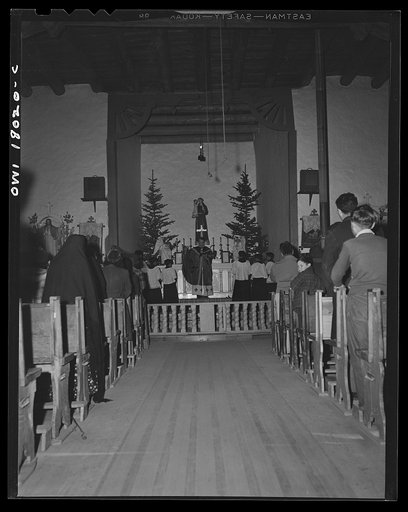 Questa, New Mexico. Father Smith preaching in Spanish over the loudspeaker in the church