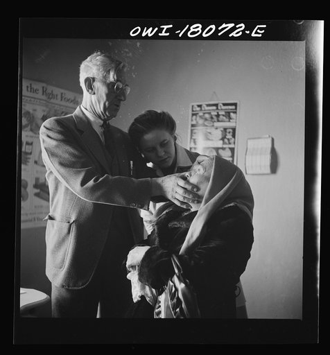 Questa, New Mexico. Doctor Onstine making an examination in the clinic operated by the Taos County cooperative health association