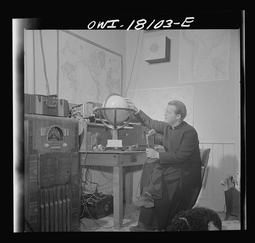 Questa, New Mexico. Father Smith broadcasting a news release in Spanish from his parish house broadcasting station