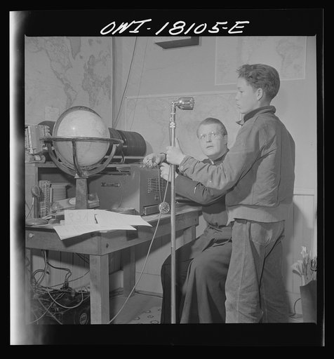 Questa, New Mexico. Local Spanish-American boy broadcasting native songs over the parish broadcasting system