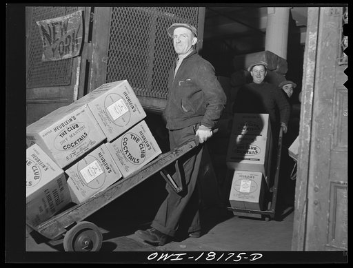 New York, New York. Associated Transport Company trucking terminal on Washington Street. Unloading goods