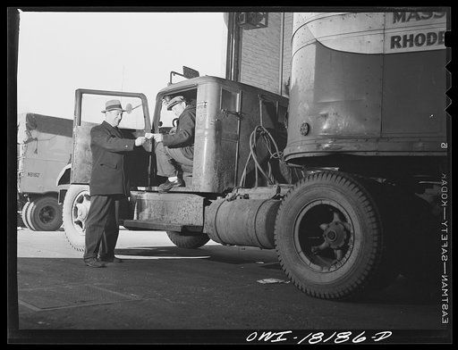 New York, New York. Associated Transport Company trucking terminal on Twenty-third Street. Dispatcher giving instructions to a driver who is going out on local delivery
