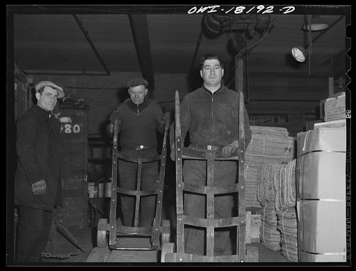 Untitled photo, possibly related to: New York, New York. Associated Transport Company trucking terminal on Washington Street. Unloading goods