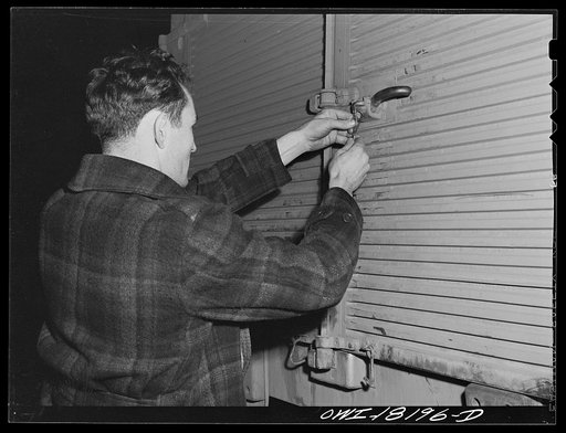 New York, New York. Associated Transport Company. Placing a seal on a locked trailer