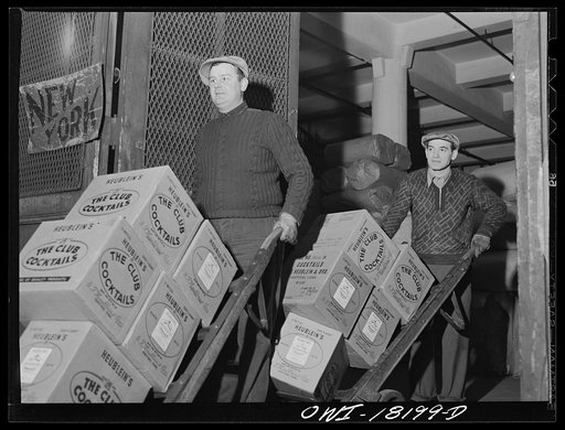 New York, New York. Associated Transport Company trucking terminal on Washington Street. Unloading goods