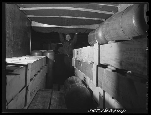 Untitled photo, possibly related to: New York, New York. Associated Transport Company. Closing up a truck which is going out on local deliveries