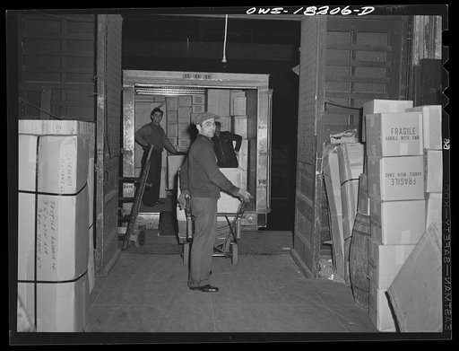 Untitled photo, possibly related to: New York, New York. Associated Transport Company trucking terminal on Washington Street. Unloading goods