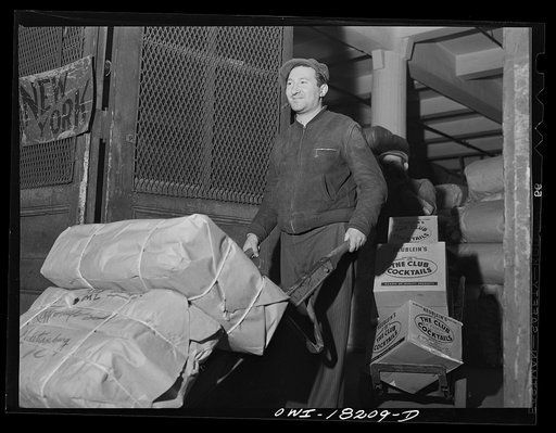 New York, New York. Associated Transport Company trucking terminal on Washington Street. Loading a truck