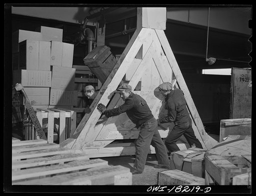 New York, New York. Associated Transport Company trucking terminal on Twenty-third Street. Unloading an airplane propeller