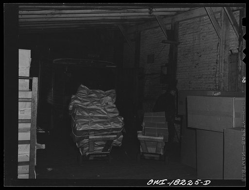 Untitled photo, possibly related to: New York, New York. Associated Transport Company trucking terminal on Twenty-third Street. Unloading goods