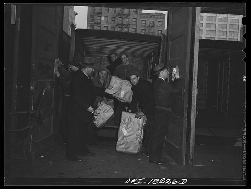 Untitled photo, possibly related to: New York, New York. Associated Transport Company trucking terminal on Twenty-third street. Truck loaders