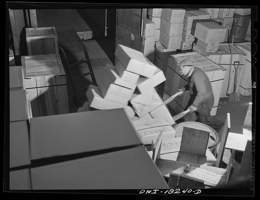 Untitled photo, possibly related to: New York, New York. Associated Transport Company trucking terminal on Twenty-third Street. Unloading goods