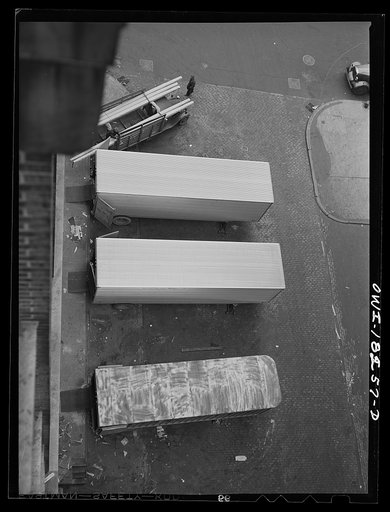 Untitled photo, possibly related to: New York, New York. Associated Transport Company trucking terminal on Twenty-third Street. Main line and local delivery trucks at the loading platform