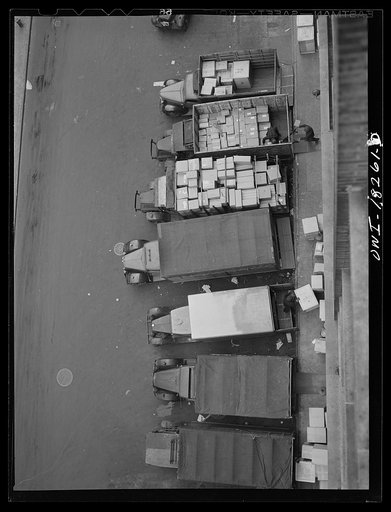 New York, New York. Associated Transport Company trucking terminal on Twenty-third street. Local delivery trucks