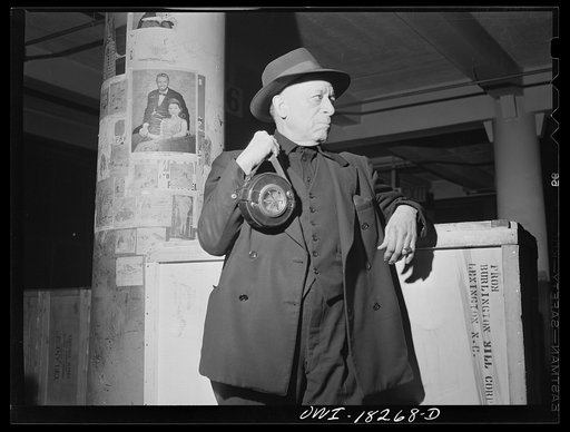 New York, New York. Associated Transport Company trucking terminal on Twenty-third Street. Night watchman