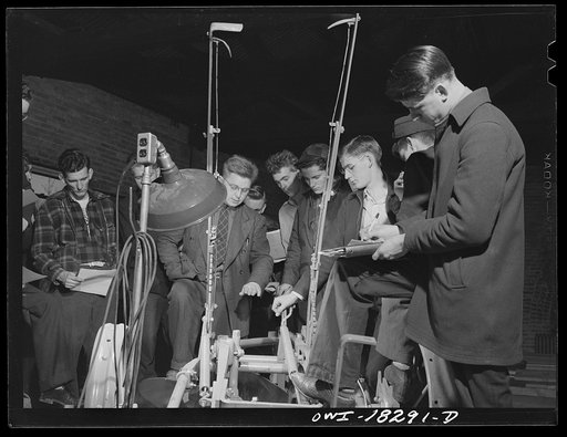 Madison, Wisconsin. Farm short course school at the University of Wisconsin. Students in the farm machinery class studying a plow. Their instructor is Professor T. Thorsen