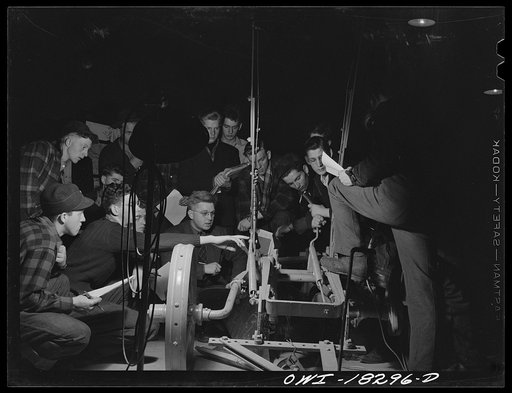 Madison, Wisconsin. Farm short course school at the University of Wisconsin. Students in the farm machinery class studying a plow. Their instructor is Professor T. Thorsen