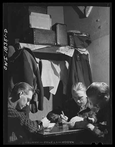 Madison, Wisconsin. Farm short course school at the University of Wisconsin. Louis Johnson, Leonard Fossum, and Morris Bjorkland writing letters to their homes in Burham County, Wisconsin