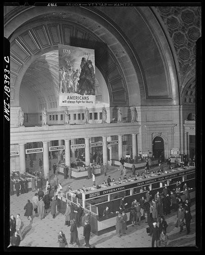 Washington, D.C. Interior view of the Union Station with Office of War Information (OWI) poster in the background