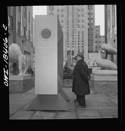Untitled photo, possibly related to: New York, New York. "United Nations" exhibition of photographs presented by the United States Office of War Information (OWI) on Rockefeller Plaza. Listening to broadcasts of President Roosevelt, Churchill, Stalin, and Chiang Kai-Chek, heard every half-hour from 