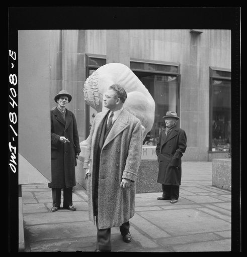 Untitled photo, possibly related to: New York, New York. "United Nations" exhibition of photographs presented by the United States Office of War Information (OWI) on Rockefeller Plaza. Listening to broadcasts of President Roosevelt, Churchill, Stalin, and Chiang Kai-Chek, heard every half-hour from 