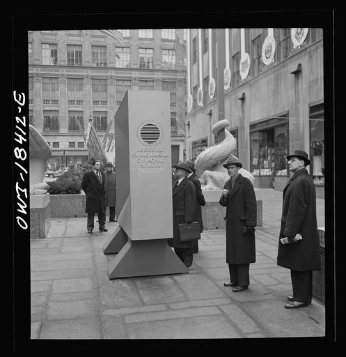 Untitled photo, possibly related to: New York, New York. "United Nations" exhibition of photographs presented by the United States Office of War Information (OWI) on Rockefeller Plaza. Listening to broadcasts of President Roosevelt, Churchill, Stalin, and Chiang Kai-Chek, heard every half-hour from 