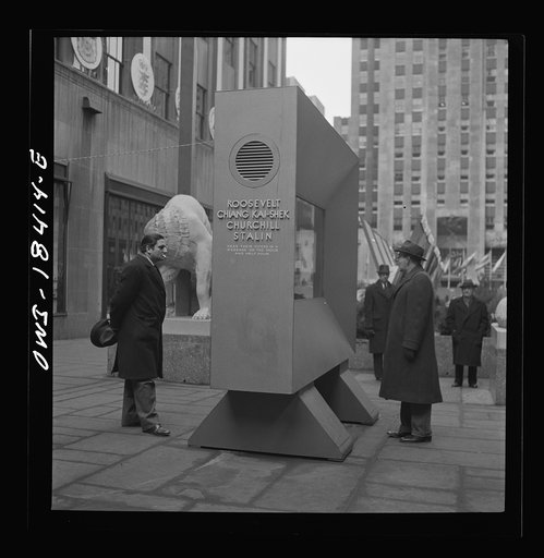 Untitled photo, possibly related to: New York, New York. "United Nations" exhibition of photographs presented by the United States Office of War Information (OWI) on Rockefeller Plaza. Listening to broadcasts of President Roosevelt, Churchill, Stalin, and Chiang Kai-Chek, heard every half-hour from 