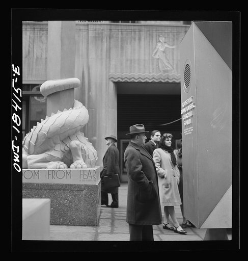 Untitled photo, possibly related to: New York, New York. "United Nations" exhibition of photographs presented by the United States Office of War Information (OWI) on Rockefeller Plaza. Listening to broadcasts of President Roosevelt, Churchill, Stalin, and Chiang Kai-Chek, heard every half-hour from 