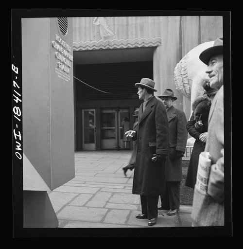 Untitled photo, possibly related to: New York, New York. "United Nations" exhibition of photographs presented by the United States Office of War Information (OWI) on Rockefeller Plaza. Listening to broadcasts of President Roosevelt, Churchill, Stalin, and Chiang Kai-Chek, heard every half-hour from 