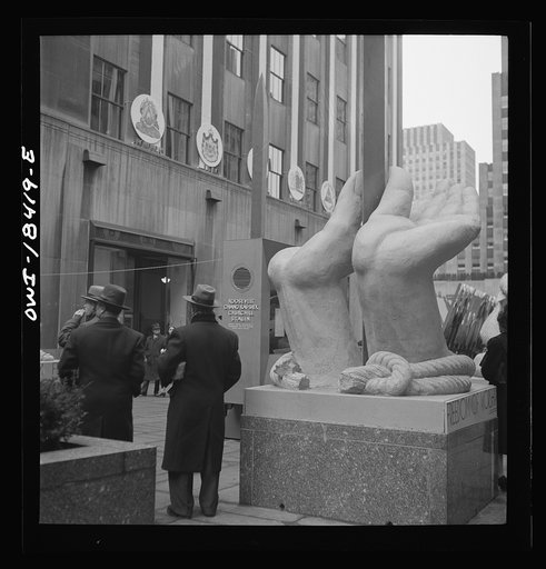 Untitled photo, possibly related to: New York, New York. "United Nations" exhibition of photographs presented by the United States Office of War Information (OWI) on Rockefeller Plaza. Listening to broadcasts of President Roosevelt, Churchill, Stalin, and Chiang Kai-Chek, heard every half-hour from 