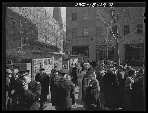 New York, New York. "United Nations" exhibition of photographs presented by the United States Office of War Information (OWI) on Rockefeller Plaza. Posters of all nations displayed on colored boards around edge of the skating rink