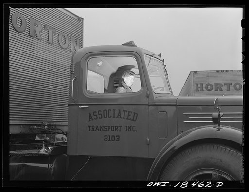 Untitled photo, possibly related to: Baltimore, Maryland. Associated Transport Company trucking terminal. "Yard jockeys" or "spotters" drive trucks around the terminal and back them up to the loading platform