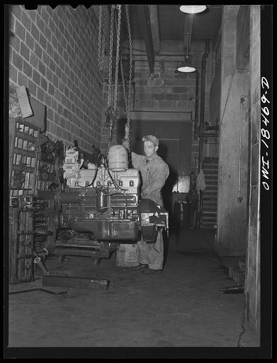 Baltimore, Maryland. Davidson Transfer Company trucking terminal. Truck motor which is to be overhauled
