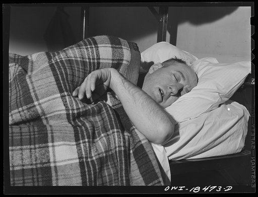 Baltimore, Maryland. Associated Transport Company trucking terminal. Driver sleeping