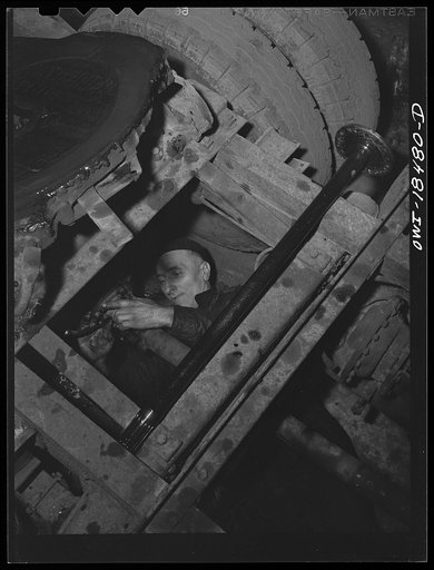 Untitled photo, possibly related to: Baltimore, Maryland. Associated Transport Company trucking terminal. Mechanic working on a truck