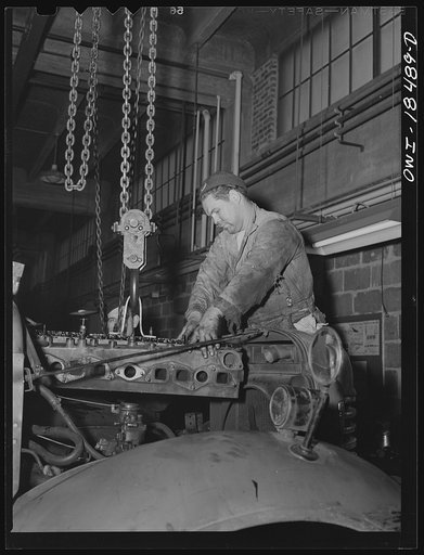 Baltimore, Maryland. Davidson Transfer Company trucking terminal. Removing the cylinder block from a truck motor
