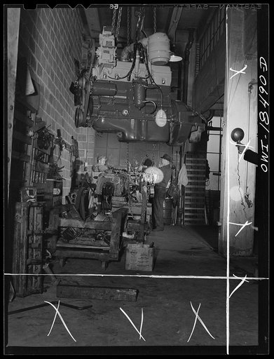 Baltimore, Maryland. Davidson Transfer Company trucking terminal. Overhauling a motor at the truck service shop