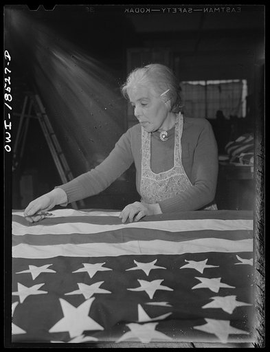 Verona, New Jersey. Italian-American woman, with two sons in the Army, at the Annin Flag Company trimming threads from a finished flag for the government