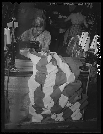Verona, New Jersey. Sewing stripes on an American flag at the Annin Flag Company