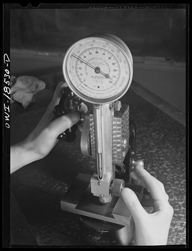 New York, New York. Class in the use of precision instruments, part of the government-sponsored industrial training program at New York University. Most of the students are women. Testing the hardness of an internal dovetail with a shore scleroscope