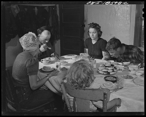 Moreno Valley, Colfax County, New Mexico. The Mutz family at dinner