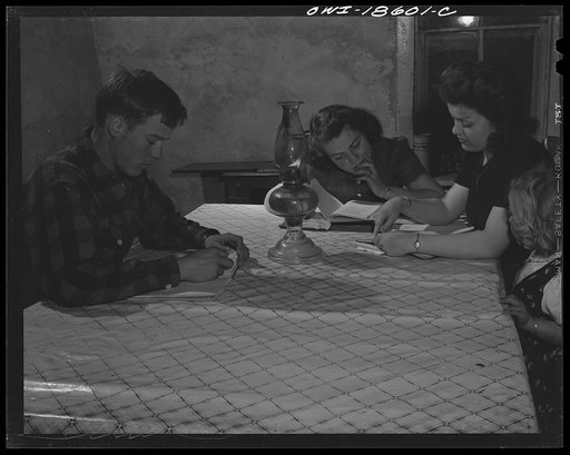 Untitled photo, possibly related to: Moreno Valley, Colfax County, New Mexico. The Mutz children doing their homework